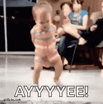 A Little Girl In A Bikini Is Dancing On A Stage . GIF