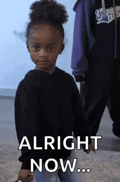 A Little Girl In A Black Sweater Is Holding A Bottle Of Water And Says Alright Now . GIF