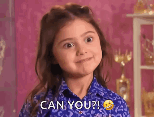 A Little Girl In A Blue Shirt Is Making A Funny Face And Saying Can You ? GIF