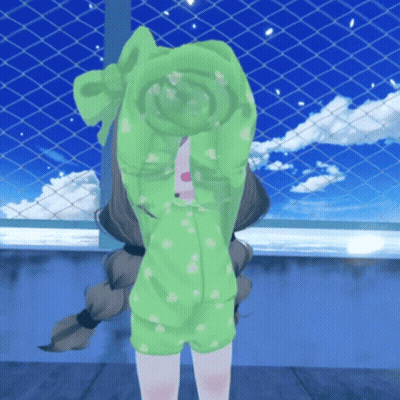 A Little Girl In A Green Outfit Covering Her Face With Her Hands GIF