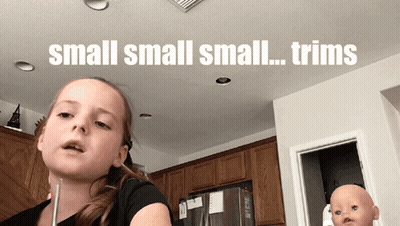 A Little Girl In A Kitchen With The Words Small Small Small Trims On The Ceiling GIF