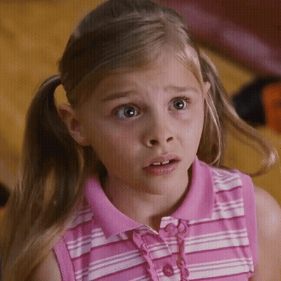 A Little Girl In A Pink And White Striped Shirt Looks Surprised GIF