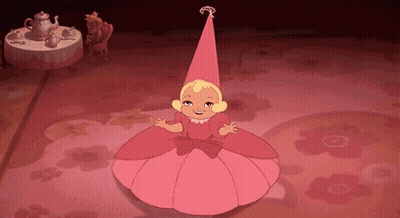 a little girl in a pink dress and hat