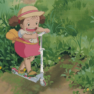 A Little Girl In A Pink Dress Is Riding A Scooter In The Grass GIF