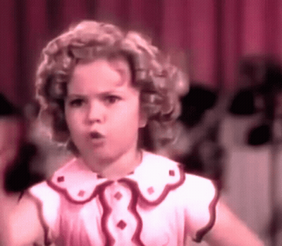 A Little Girl In A Pink Dress With A Red Collar GIF