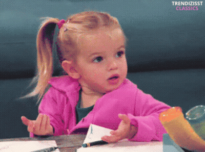 A Little Girl In A Pink Jacket Sits At A Table With The Words Trendizisst Classics Below Her GIF