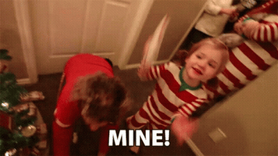 A Little Girl In A Red And White Striped Pajamas Is Holding A Piece Of Paper And Says Mine GIF