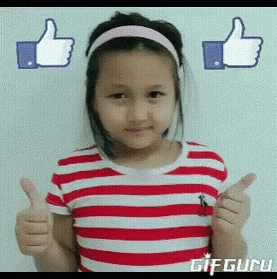 A Little Girl In A Red And White Striped Shirt Is Giving A Thumbs Up GIF