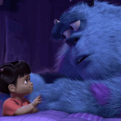 A Little Girl In A Red Shirt Is Touching A Blue Stuffed Animal GIF
