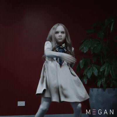 A Little Girl In A White Dress Is Dancing In Front Of A Potted Plant With Megan Written On The Bottom GIF