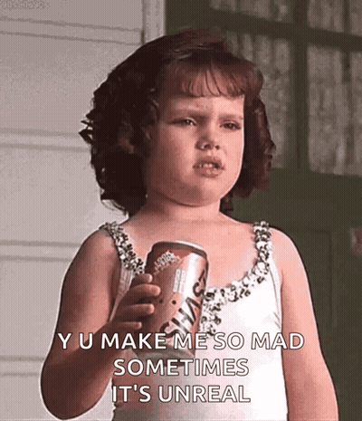 A Little Girl In A White Dress Is Holding A Can Of Soda And Making A Funny Face . GIF