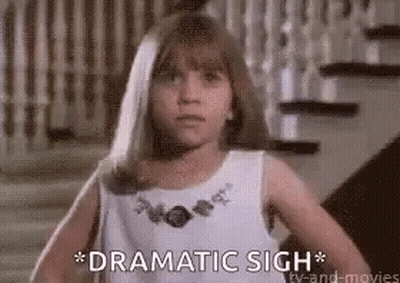 A Little Girl In A White Dress Is Standing In Front Of A Set Of Stairs And Says `` Dramatic Sigh '' . GIF