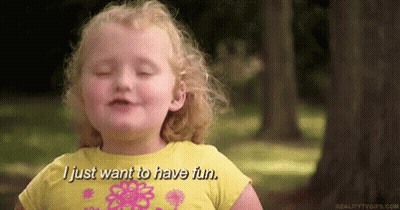 A Little Girl In A Yellow Shirt Is Smiling And Saying `` I Just Want To Have Fun . '' GIF