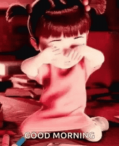 A Little Girl Is Covering Her Face With Her Hands And The Words `` Good Morning '' Written On The Bottom . GIF
