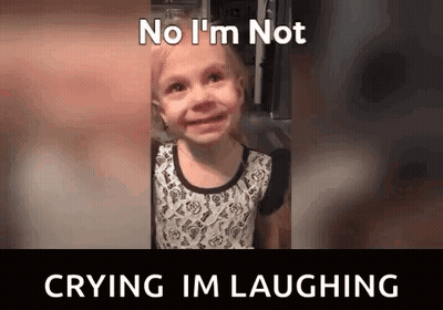 A Little Girl Is Crying And Laughing With The Words No I 'M Not Crying I 'M Laughing . GIF