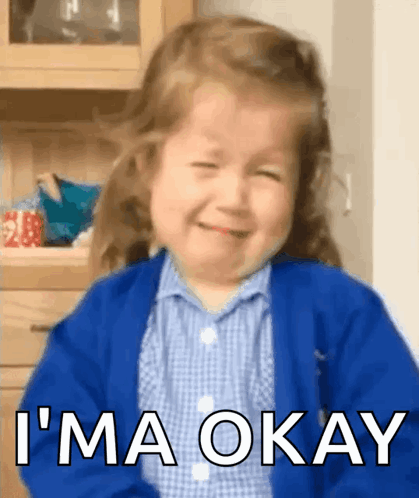 A Little Girl Is Crying And Smiling With The Words " I 'M Okay " Above Her GIF