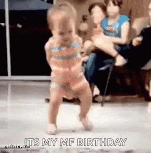 A Little Girl Is Dancing In Front Of A Group Of People And Says `` It 'S My Birthday '' . GIF