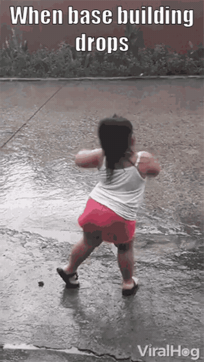 A Little Girl Is Dancing In The Rain With The Caption When Base Building Drops Viralhog GIF