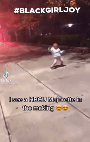 A Little Girl Is Dancing On A Sidewalk With A Caption That Says Blackgirljoy GIF