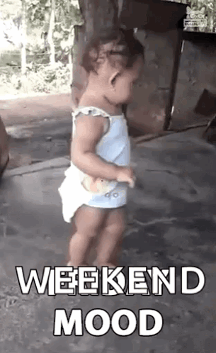A Little Girl Is Dancing On The Ground With The Words `` Weekend Mood '' Written Above Her . GIF