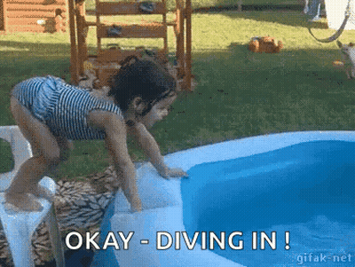 A Little Girl Is Diving Into An Inflatable Pool With The Words Okay Diving In Below Her GIF