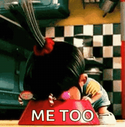 A Little Girl Is Eating Out Of A Red Bowl That Says Me Too . GIF