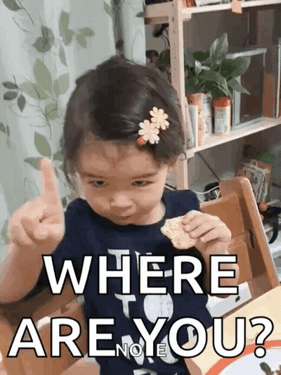 A Little Girl Is Giving A Thumbs Up While Sitting At A Table And Says Where Are You ? GIF