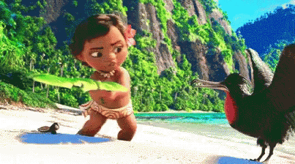 A Little Girl Is Holding A Leaf While Standing Next To A Bird On The Beach GIF