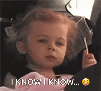 A Little Girl Is Holding A Lollipop And Says I Know I Know ... GIF