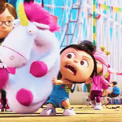 A Little Girl Is Holding A Stuffed Unicorn With A Purple Mane GIF