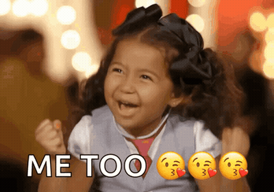 A Little Girl Is Holding Her Fist In The Air With The Words Me Too Written Above Her GIF