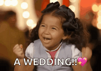 A Little Girl Is Holding Her Fist Up And Saying A Wedding . GIF