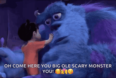 A Little Girl Is Hugging A Monster From The Movie Monsters Inc . GIF