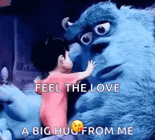 A Little Girl Is Hugging A Stuffed Animal From Monsters Inc . GIF