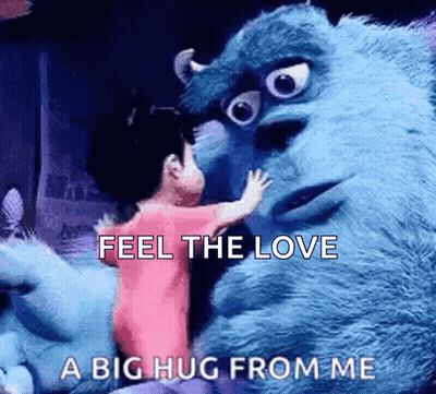 A Little Girl Is Hugging A Stuffed Animal From Monsters Inc . GIF