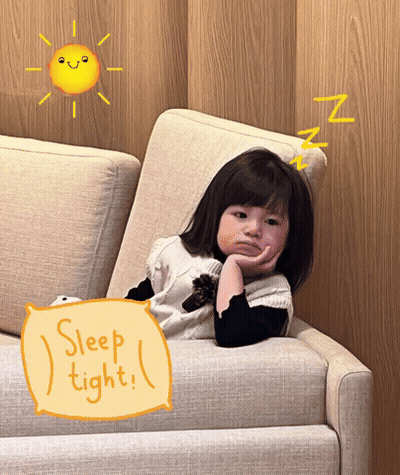 A Little Girl Is Laying On A Couch With A Pillow That Says Sleep Tight GIF