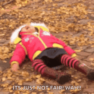 A Little Girl Is Laying On A Pile Of Leaves With The Words " It 'S Just Not Fair Wah ! " GIF