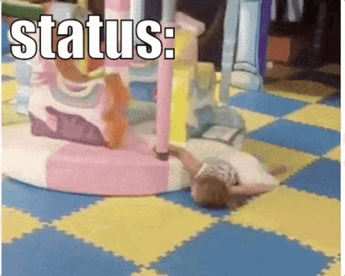 A Little Girl Is Laying On The Floor In A Playground With The Words Status Written On The Bottom GIF