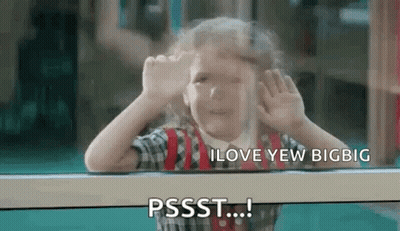 A Little Girl Is Looking Out Of A Window And Making A Face . GIF