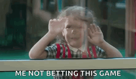 A Little Girl Is Looking Out Of A Window And Making A Funny Face While Saying `` Me Not Betting This Game '' . GIF