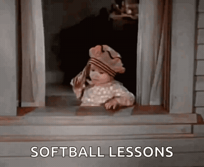 A Little Girl Is Looking Out Of A Window And The Words Softball Lessons Are On The Screen GIF