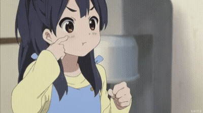 A Little Girl Is Making A Funny Face And Pointing At Her Nose . GIF