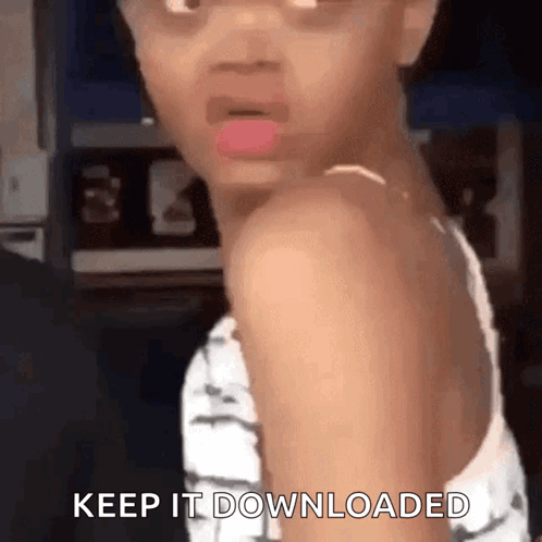 A Little Girl Is Making A Funny Face And Saying `` Keep It Downloaded '' While Looking Over Her Shoulder . GIF