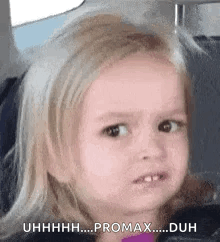 A Little Girl Is Making A Funny Face In The Back Seat Of A Car . GIF