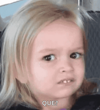 A Little Girl Is Making A Funny Face While Sitting In A Car . GIF