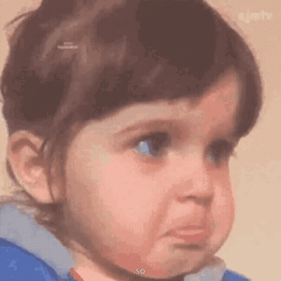 A Little Girl Is Making A Sad Face With Her Eyes Closed . GIF