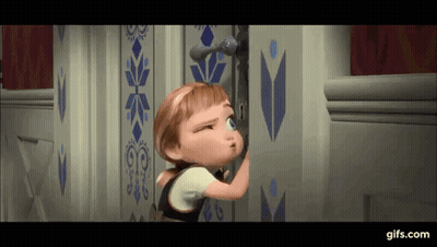 A Little Girl Is Peeking Out Of A Door In A Frozen Movie . GIF
