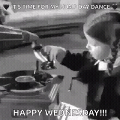 A Little Girl Is Playing Music On A Record Player . GIF