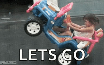 A Little Girl Is Riding A Toy Car With The Words Let 'S Go Written On It . GIF