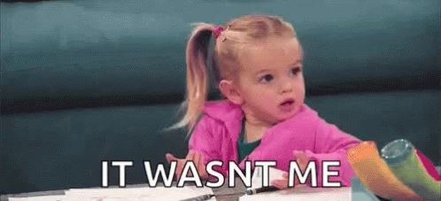 A Little Girl Is Sitting At A Table With A Marker In Her Hand And Says `` It Wasn T Me '' . GIF